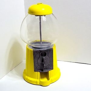 Working yellow candy dispenser/coin bank.